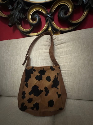 Shoulder bag with cow print used, black and brown