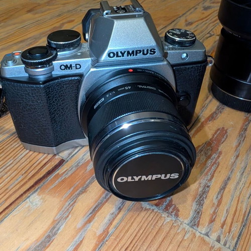 Olympus OM-D E-M10 camera with 2 prime lenses and accessories