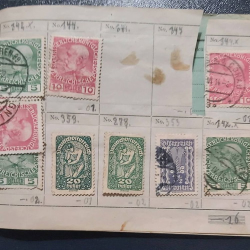 Stamp album used with Austrian stamps, all sealed with hinges