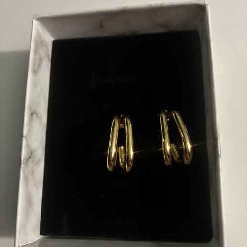 Steel hoop earrings in gold color new in box