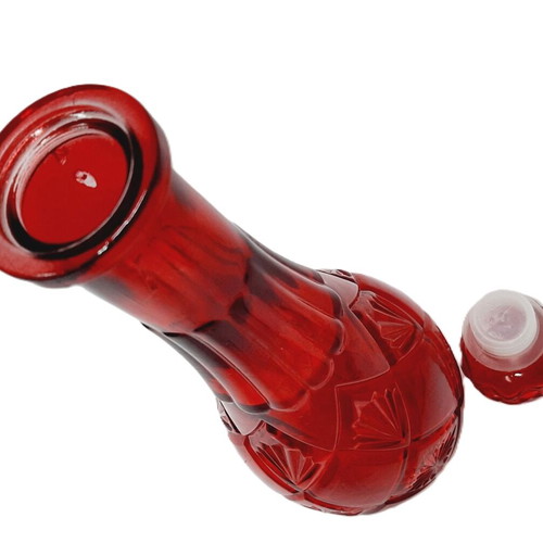 Vintage red glass bottle with decorative stopper, like new