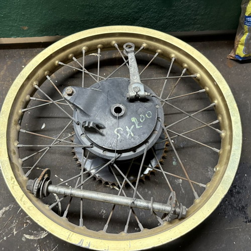 Suzuki SX 200 rear wheel used with drum and axle