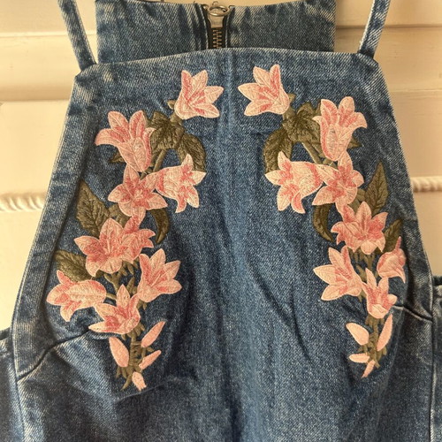 Attrattivo denim dress used with embroidered flowers and pockets