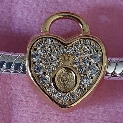 Charm stopper heart new, gold color with white zirconia and Pandora logo
