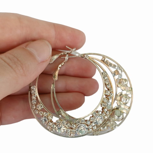 Hoop earrings with rhinestones used, flashy style