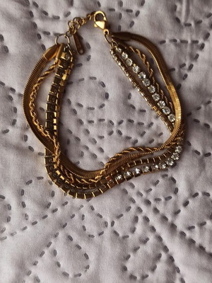 Bracelet with 4 chains like new, gold tone