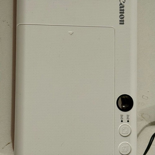 Canon Zoemini C camera used, pink Polaroid-style with internal battery repair needed