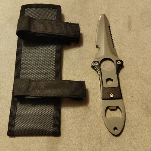 Stainless steel knife new with sheath and saw blade