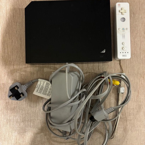 Nintendo Wii console black used with cables and controller