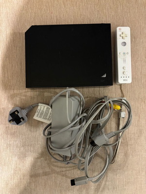Nintendo Wii console black used with cables and controller