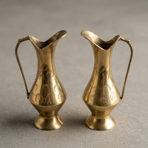 Brass pitchers set like new with carved designs and natural patina