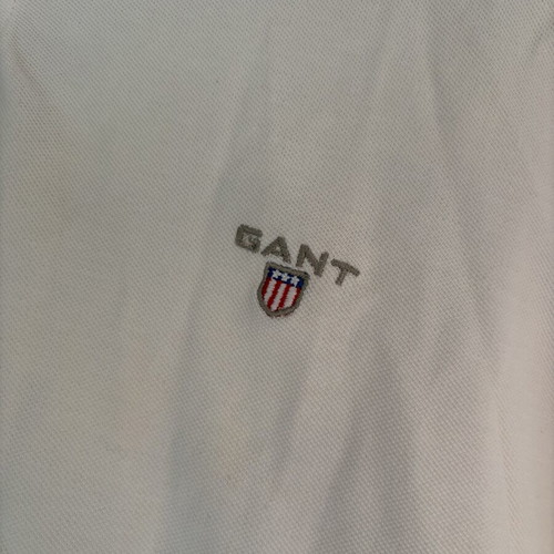 Two white polo shirts used, size XL, slight yellow stain on one