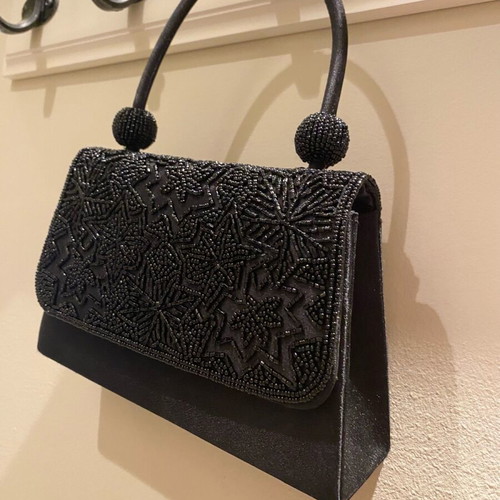 Mini black handbag like new with beaded embossed design