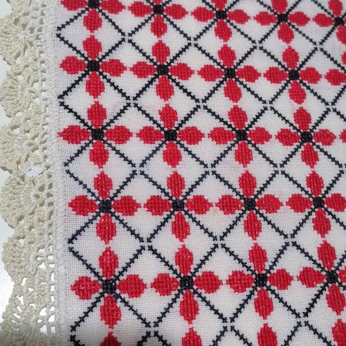 Large embroidered table runner used with handmade lace