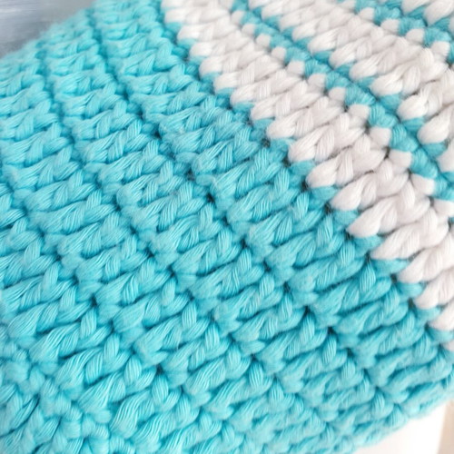 Handmade turquoise knitted pouch toiletry bag used