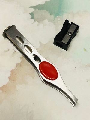 Eyebrow tweezers with light like new and pencil sharpener