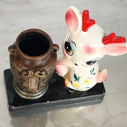 Ceramic decorative vase with thermometer used