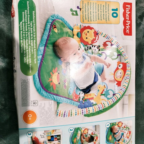 Fisher Price colorful activity gym for newborns used with extra toys