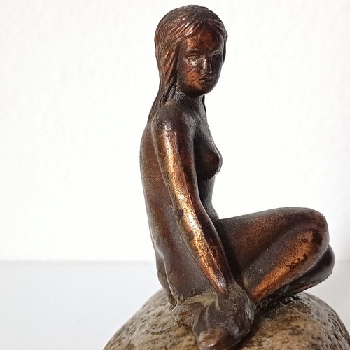 Vintage bronze Little Mermaid statue on natural stone used