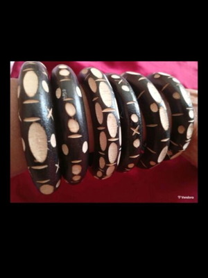 Set of six handmade wooden bracelets with engraved decorations like new