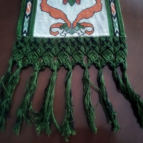 Handmade table runner with intricate crochet fringes and embroidery
