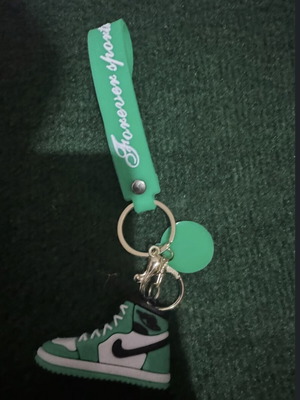 Nike shoe keychain, green and white