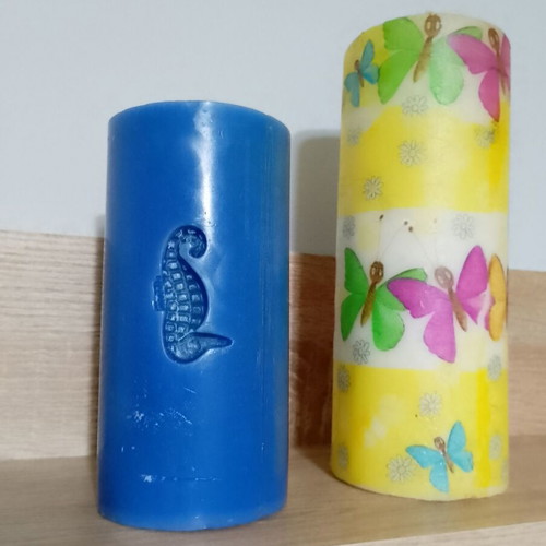 Decorative candles, blue and yellow butterfly design