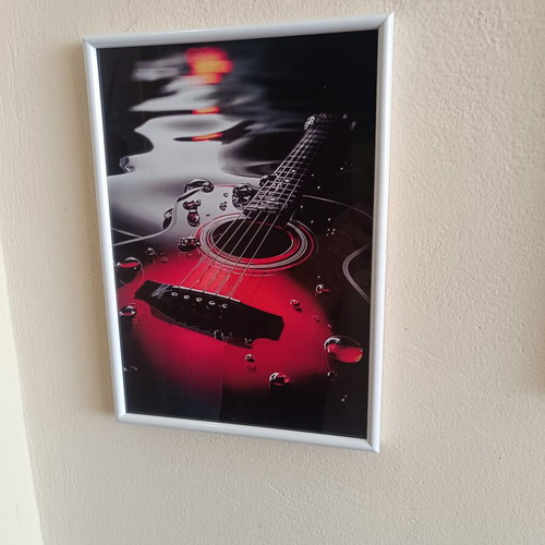 Decorative frame 30×20 cm with guitar theme like new