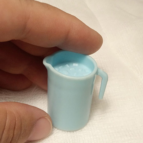 Large miniature pitcher with ice cubes plastic