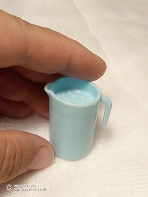 Large miniature pitcher with ice cubes plastic