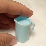 Large miniature pitcher with ice cubes plastic