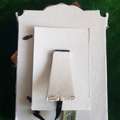 Frame with hanging decorations used, broken support