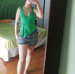 Green blouse with ring detail, size Small