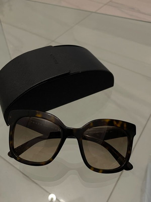 Prada SPR 24Q sunglasses used, brown tortoise design with case