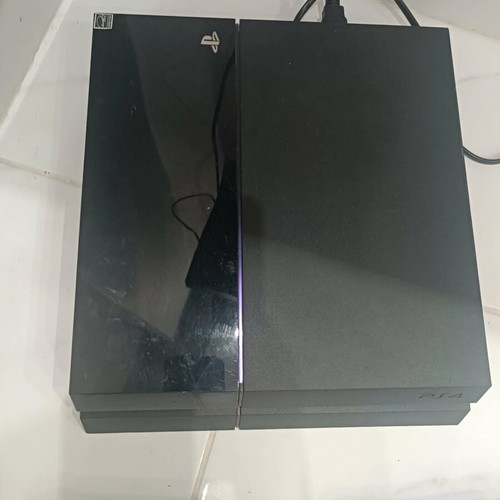 PlayStation 4 console with 2 controllers and cables