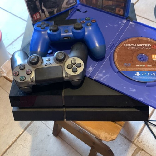 PlayStation 4 console 1TB used with 2 controllers and 3 games