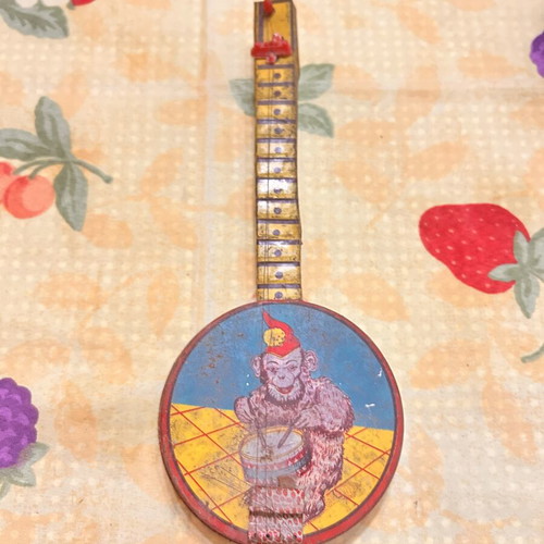 Greek Panigyriotiko tin toy banjo with monkey lithograph