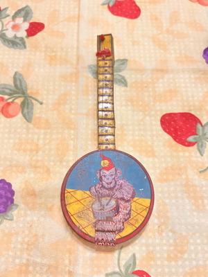 Greek Panigyriotiko tin toy banjo with monkey lithograph