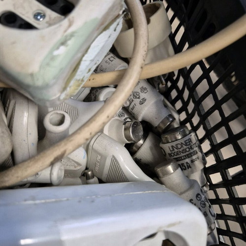 Electrical supplies like new, over 100 pieces including fuses and plugs