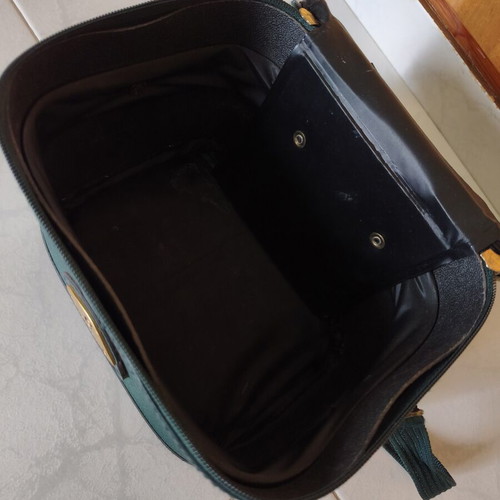 Toiletry bag used, green, fabric defect