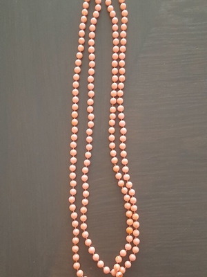Long necklace with faux pearls, like new, salmon color