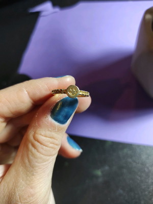 Smiley face ring used, gold color with embossed pattern