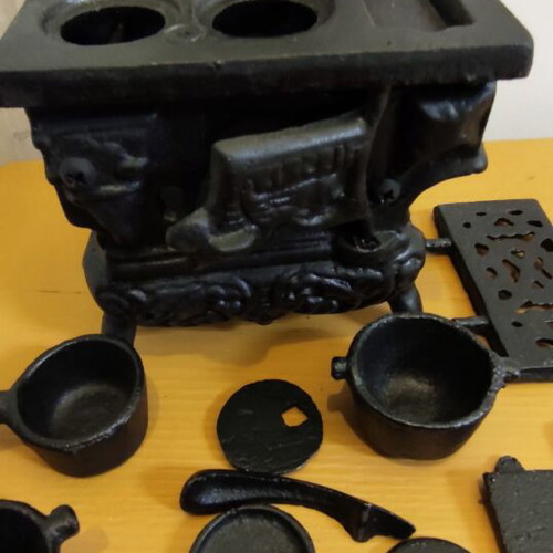 Miniature wooden stove with cast iron accessories like new
