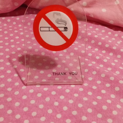 Plexiglass stand like new with no smoking sign