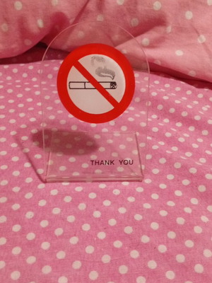 Plexiglass stand like new with no smoking sign