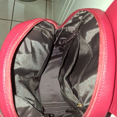 Women's red backpack with gold details