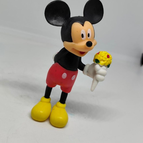 Collectible Mickey Mouse figure like new with bouquet