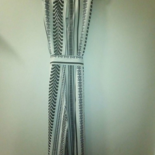One-piece jumpsuit size S with slanted pockets and belt