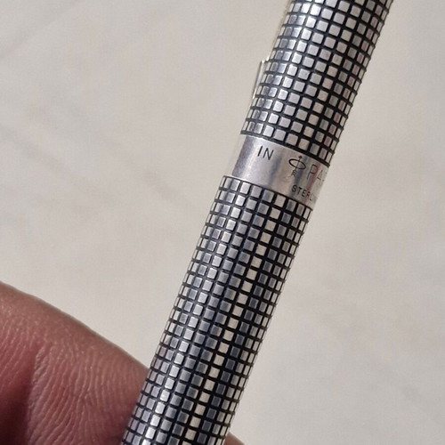 Parker pen in like new condition, possibly silver or silver-plated