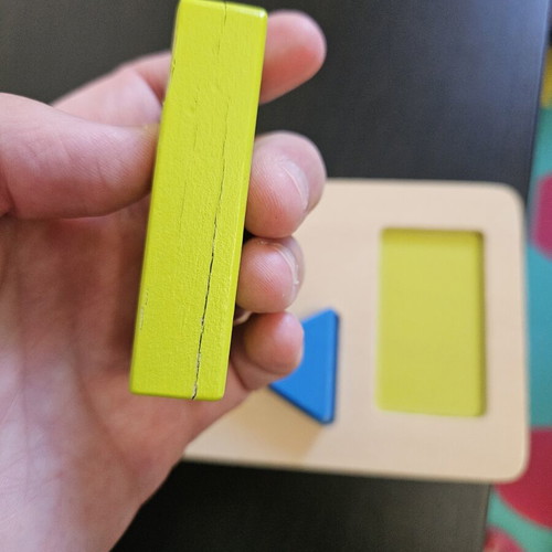 Hape shape puzzle used with marks from small hands
